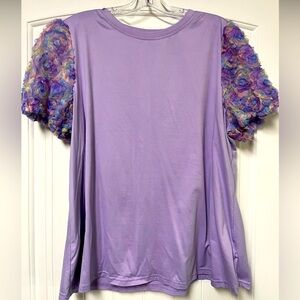 Women’s blouse with 3D floral sleeve cap